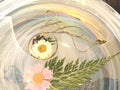 Daisy Round Pendant with purple accent flower