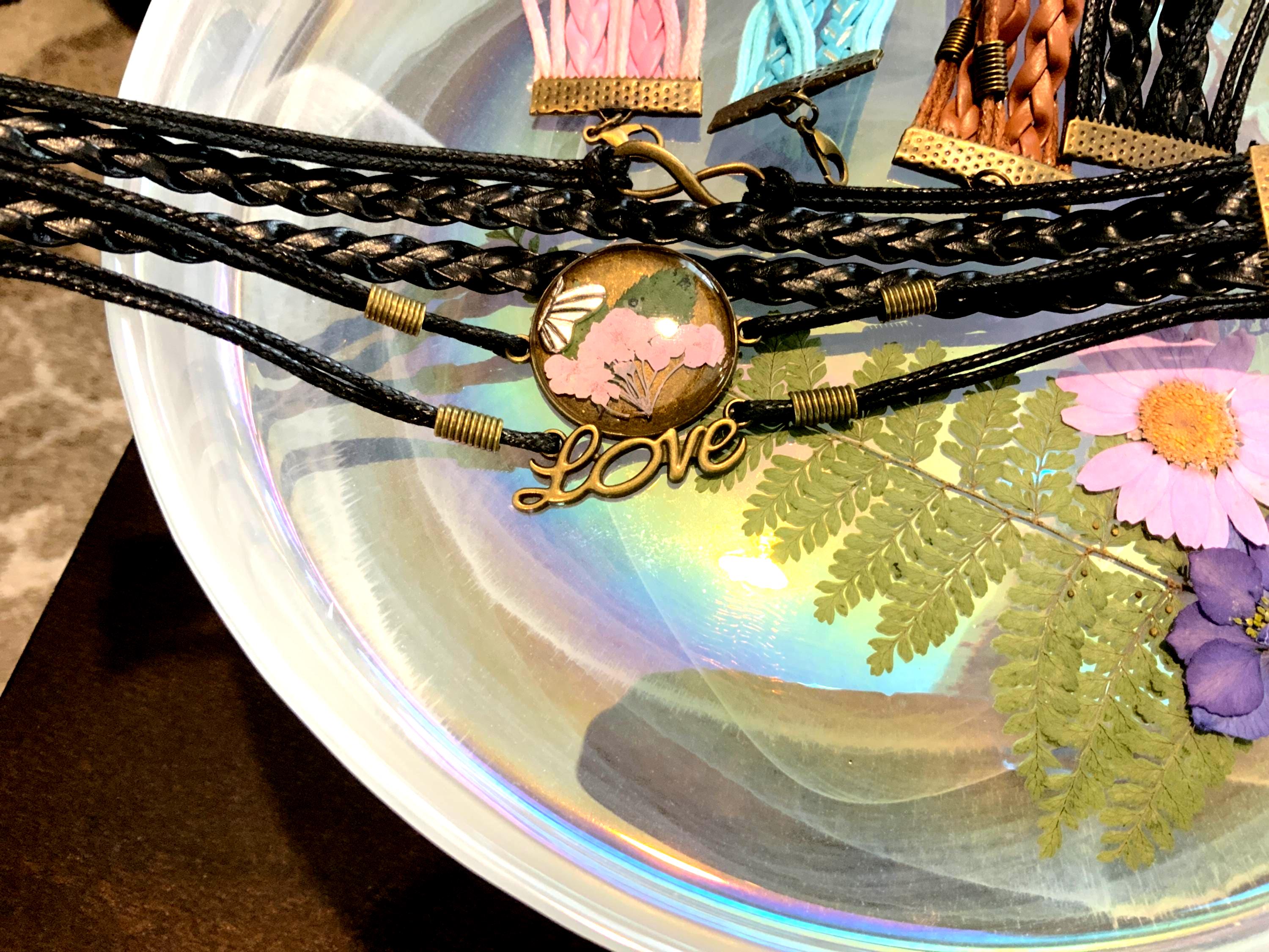 Love leather bracelet with pink flower