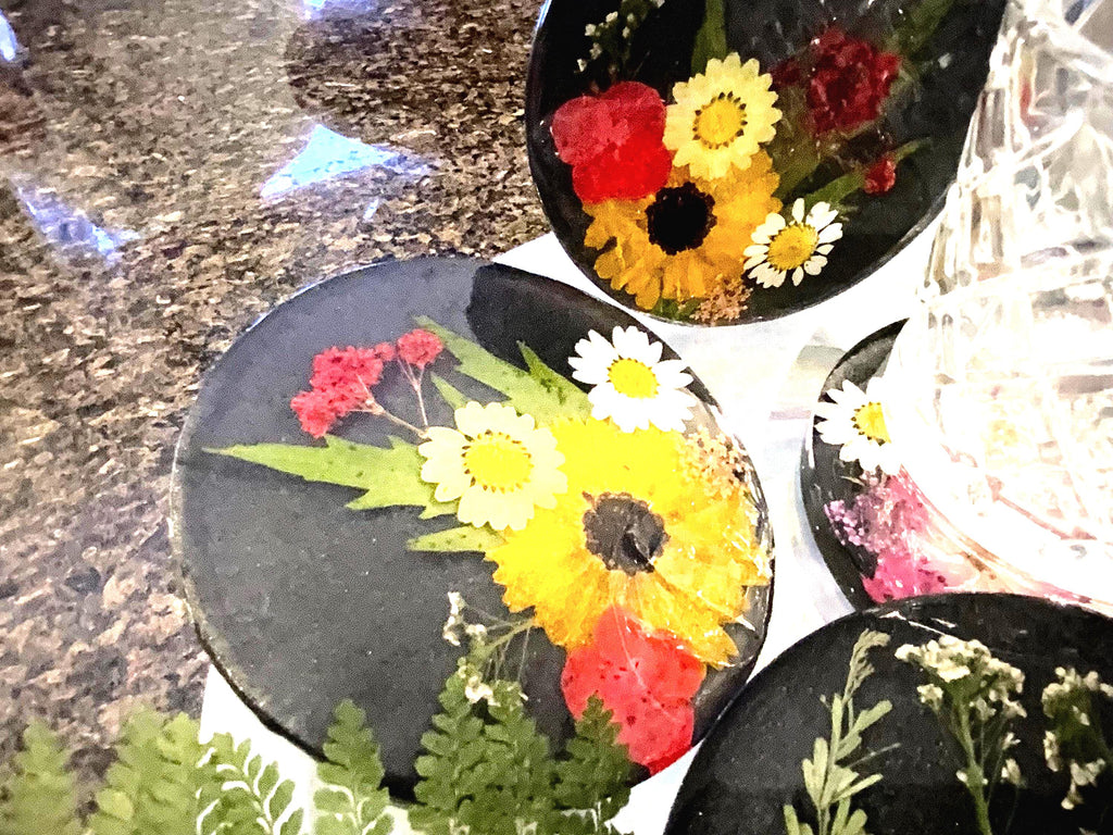 4 Piece black and pressed floral Coaster set