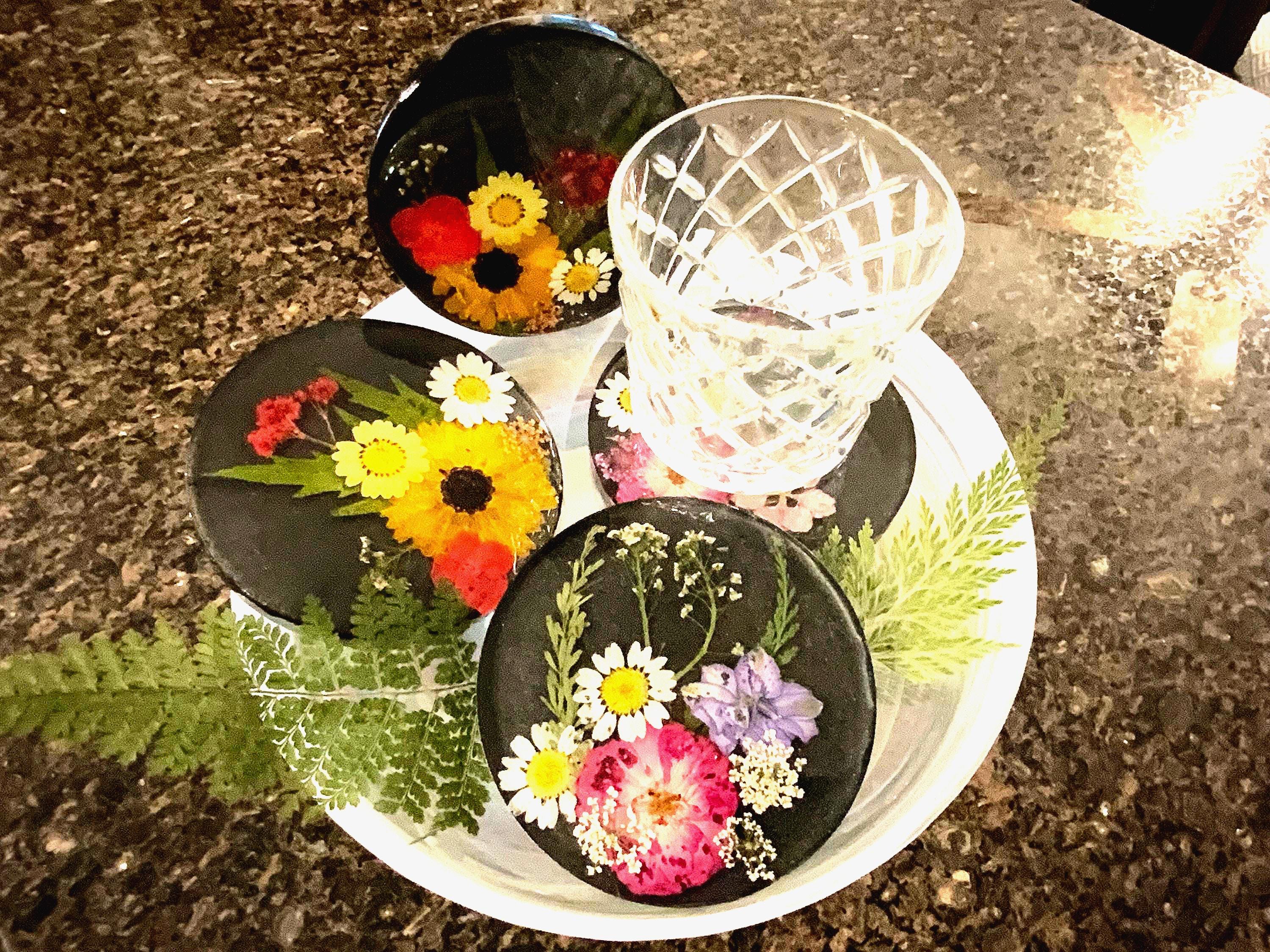 4 Piece black and pressed floral Coaster set