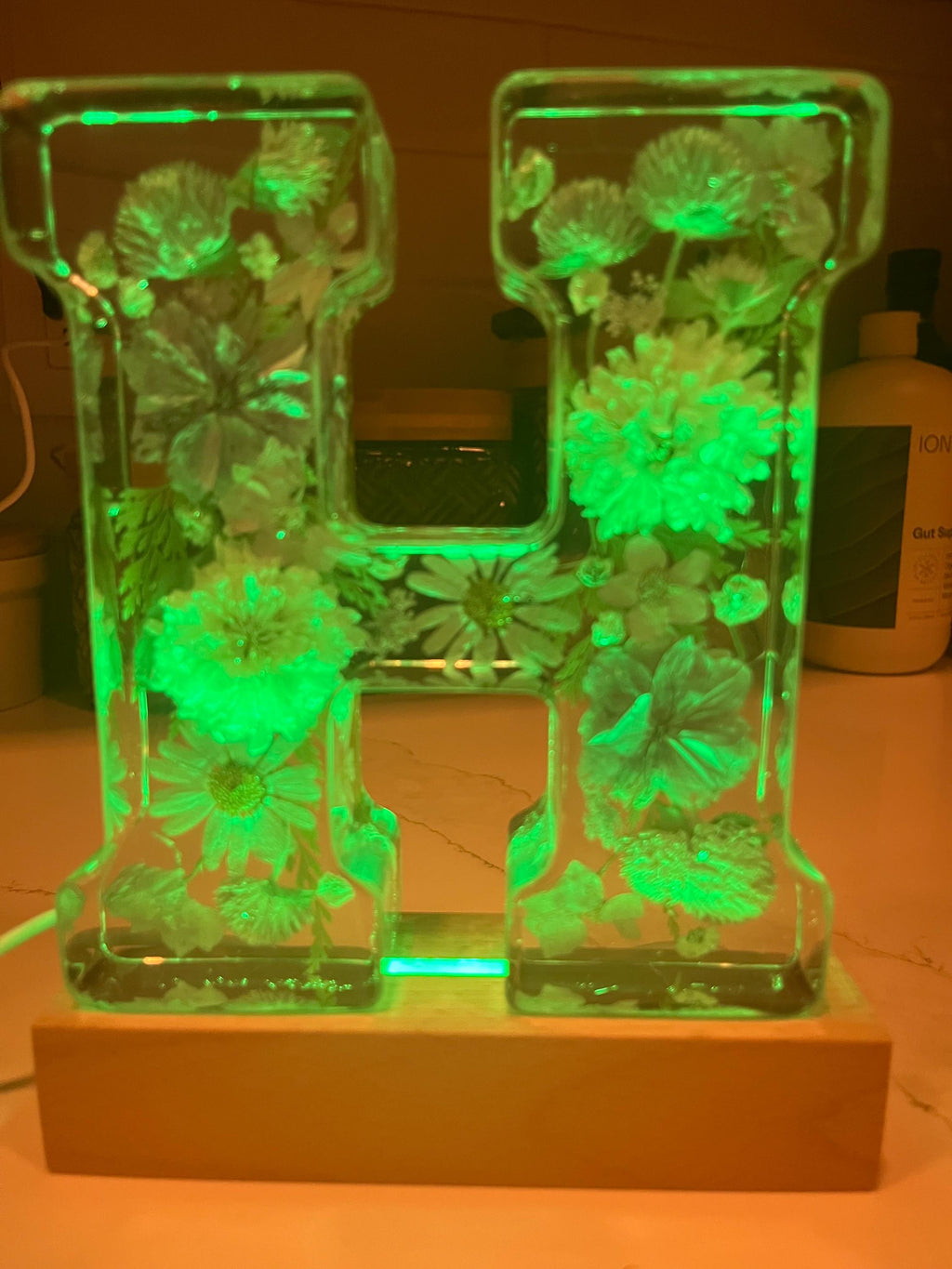 Floral Lighted Letter: Twinkle Light Night Light (6" Tall) comes on a LED wooden lighted base.